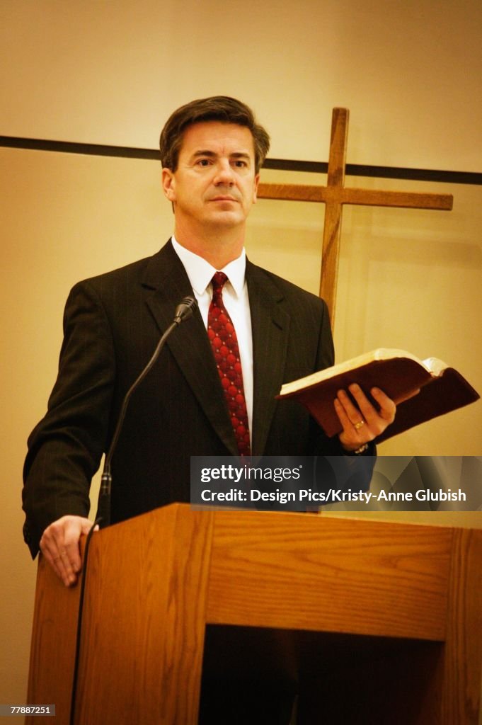 Pastor preaching from pulpit