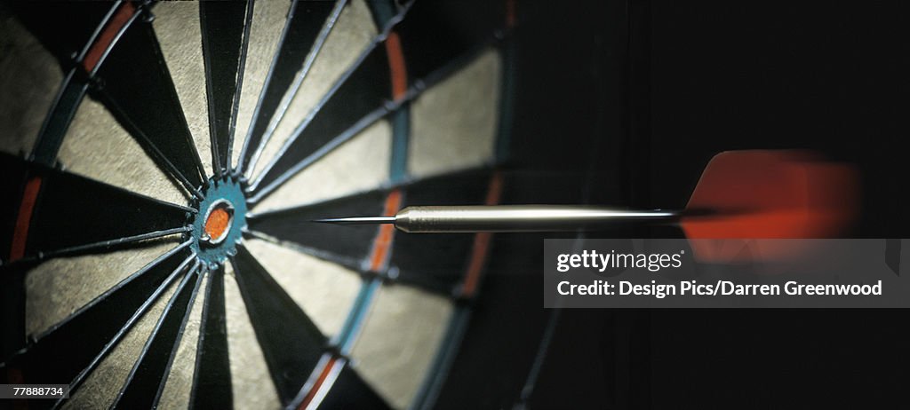 Dart flying to dartboard