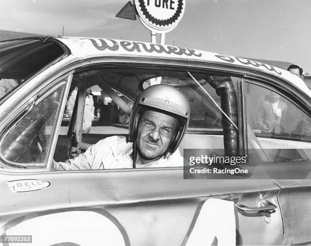 Wendell Scott poses for a portrait in his car as he became the first African-American driver to win in the NASCAR Cup division with a victory in 1963...