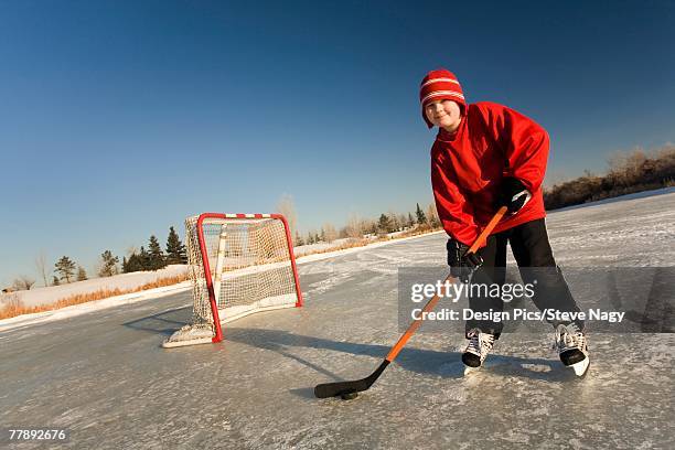 boy playing hockey - ice hockey day 9 foto e immagini stock