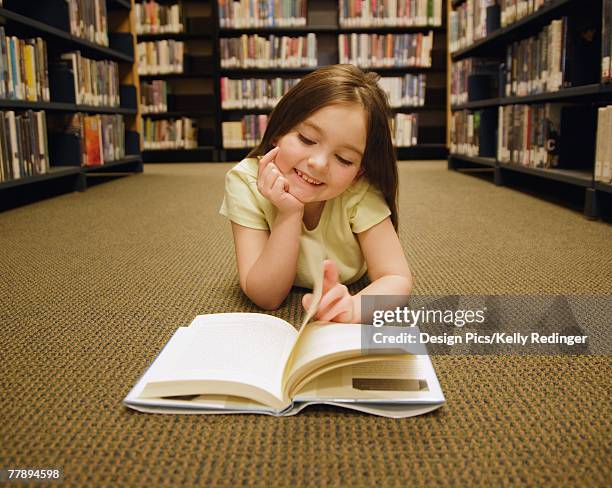 girl reading book - edmonton library stock pictures, royalty-free photos & images