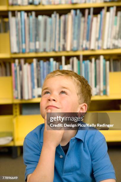 little boy in library - alberta stock pictures, royalty-free photos & images