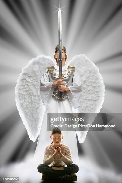 girl praying with angel protecting her - anjo da guarda imagens e fotografias de stock