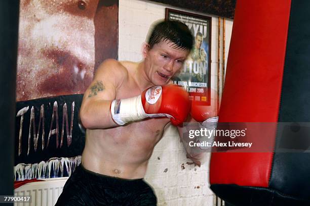 Ricky Hatton of Great Britain hits a punch bag during an open training session for the media held at the Phoenix Camp at the Betta Bodies Gym on...