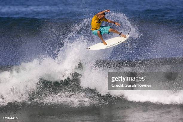 Danilo Costa of Brazil surfs during the Round of 128 surfs in the Vans Triple Crown of Surfing Reef Hawaiian Pro at Haleiwa Alii Beach Park November...