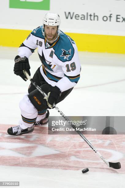 Joe Thornton of the San Jose Sharks controls the puck during the NHL game against the Calgary Flames at the Pengrowth Saddledome on October 22, 2007...