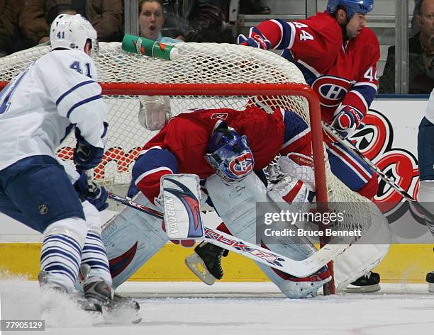 Carey Price of the Montreal Canadiens has the net flip over on him as Jiri Tlusty of the Toronto Maple Leafs cruises in front on November 13, 2007 at...