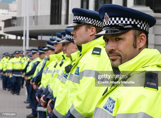 Police watch the Tuhoe hikoi protesters protest at the grounds of Parliament during a protest November 14, 2007 in Wellington, New Zealand. Maori are...