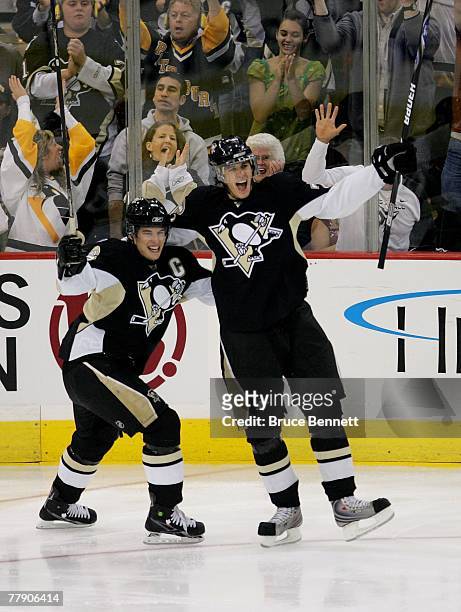 Sidney Crosby celebrates a goal by Evgeni Malkin at 44 seconds of the second period during the NHL game against the New York Rangers of the...