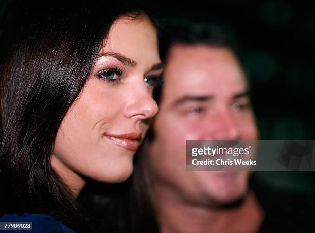 Model Adrienne Curry, left, and Christopher Knight attend a party for EA's "Need for Speed ProStreet" video game at Les Deux Cafe on November 13,...