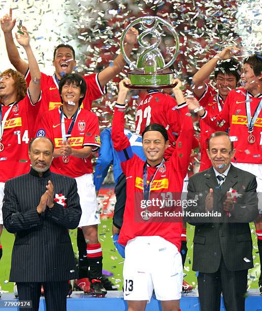 Keita Suzuki and the players of Japan's Urawa Red Diamonds celebrate on the victory podium after defeating Iran's Sepahan during the AFC Champions...