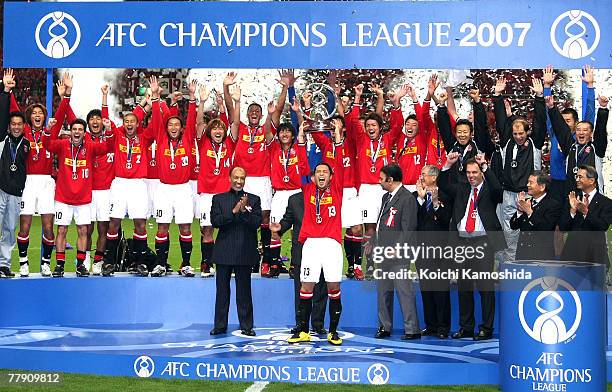 Keita Suzuki and the players of Japan's Urawa Red Diamonds celebrate on the victory podium after defeating Iran's Sepahan during the AFC Champions...