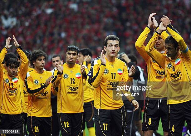 Players of Iran's Sepahan Moharram Navidkia, Mohsen Benkar, Hossein Kazemi, Abdul Wahab Labed, Ebrahim Lovinian, Mahmoud Karimi Sibaki cheer their...