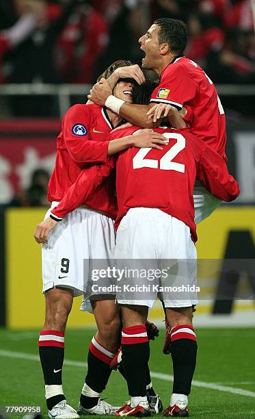 Yuki Abe of Urawa Reds celebrates with his team mates after scoring second goal against Iran's Sepahan during the AFC Champions League Final 2nd leg...