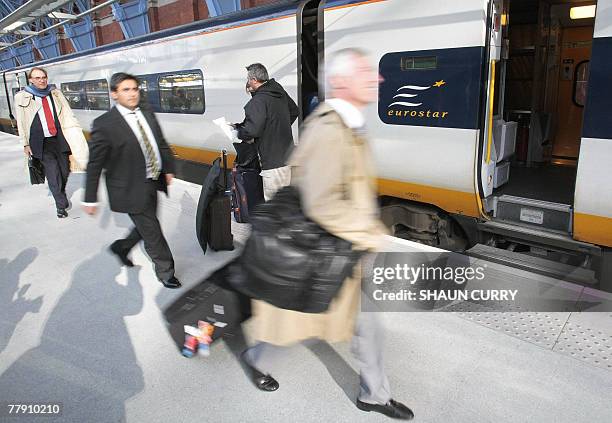 Passengers disembark from a Eurostar train at St Pancras International train station in north London, 14 November 2007. Eurostar zoomed into a new...