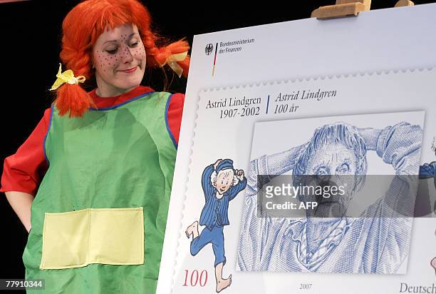 Anne Talhofer dressed as Pippi Longstocking presents a special stamp displaying Swedish author Astrid Lindgren, 13 November 2007 in Berlin. The stamp...
