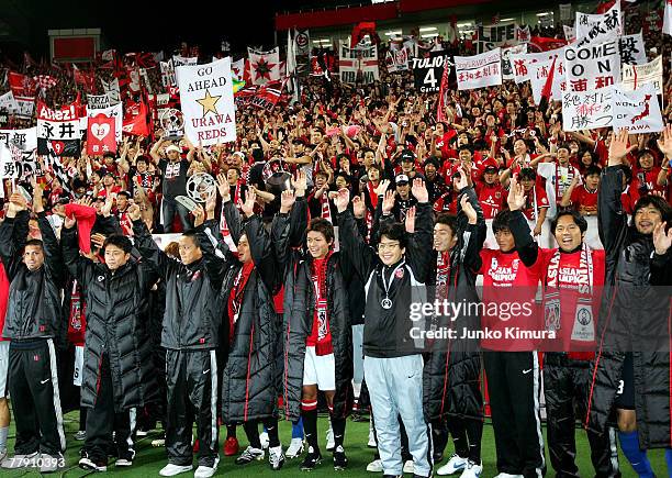 Players and fans of Urawa Reds celebrate winning the AFC Champions League Final second leg match between the Urawa Reds and Sepahan at Saitama...