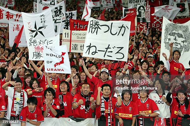 Urawa Reds fans celebrate the victory of at the AFC Champions League Final second leg match between the Urawa Reds and Sepahan at Saitama Stadium on...