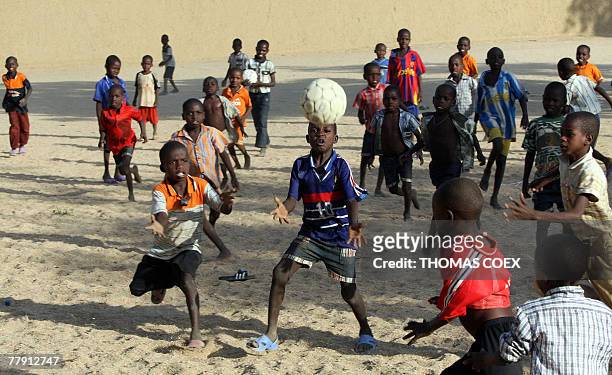 Some of the 103 children, who were nearly abducted by a French charity, play football 14 November 2007 at an orphanage in the eastern Chadian town of...