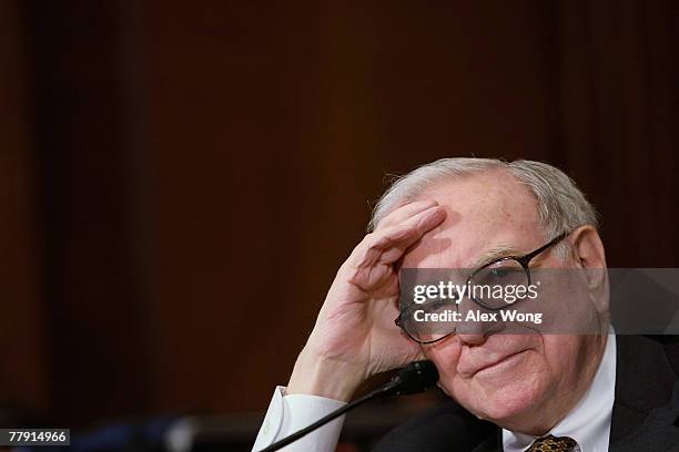 Berkshire Hathaway Chairman and CEO Warren Buffett listens during a hearing before the Senate Finance Committee November 14, 2007 on Capitol Hill in...