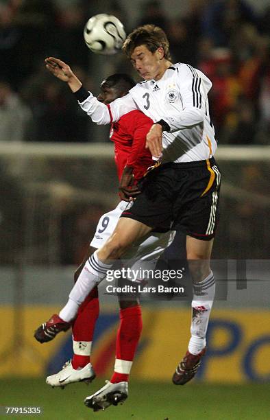 Tope Obadeyi of England goes up for a header with Holger Badstuber of Germany during the U19 international friendly match between Germany and England...