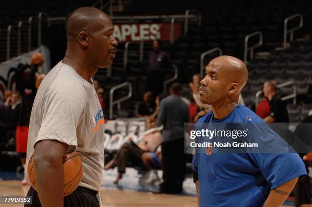 Stephon Marbury of the New York Knicks speaks with Assistant Coach Herb Williams prior to the game against the Los Angeles Clippers at Staples Center...