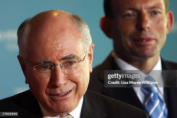 Prime Minister John Howard and Tony Abbott attend a Liberal Party press conference November 15, 2007 in Cairns, Australia. John Howard announced as a...