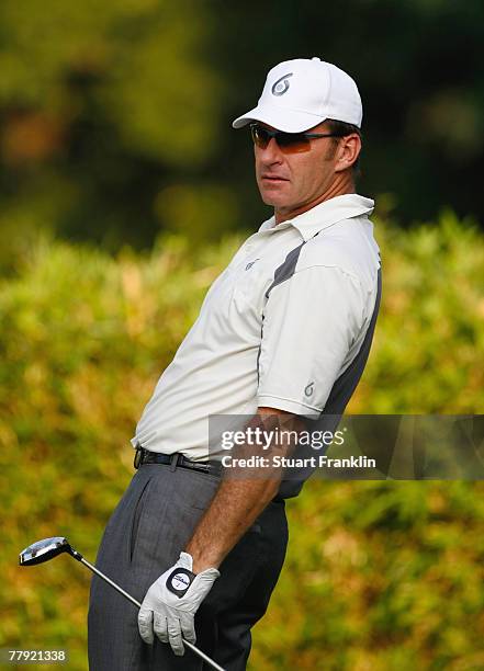 Nick Faldo of England reacts to his tee shot on the 17th hole during the first round of the UBS Hong Kong Open at the Hong Kong Golf Club on November...