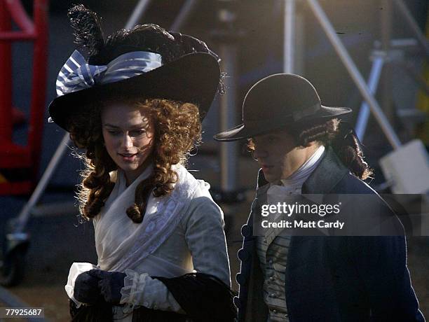 Keira Knightley walks with co-star Dominic Cooper as they rehearse a scene on the film set for 'The Duchess' on November 15 2007 in Bath, England