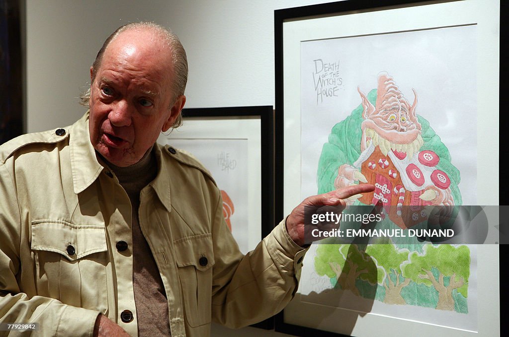 Artist Gahan Wilson points at one of his