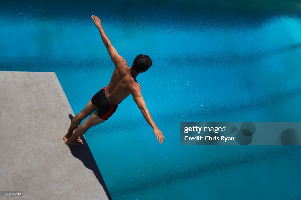 Diver standing on diving board