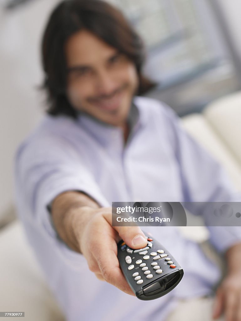 Man using television remote