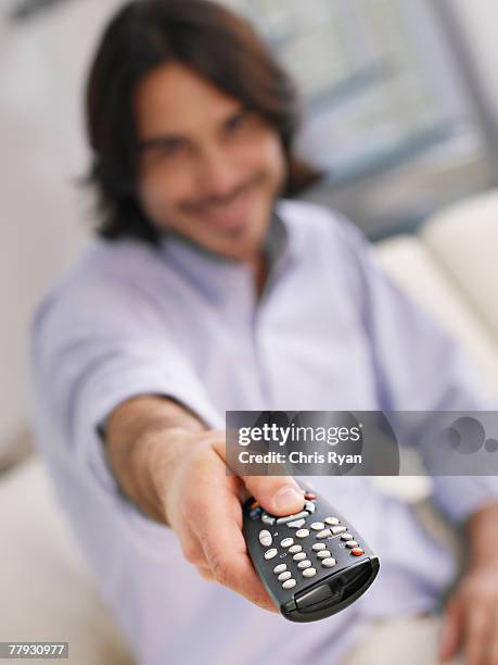 Man Pointing Remote Control Photos and Premium High Res Pictures ...