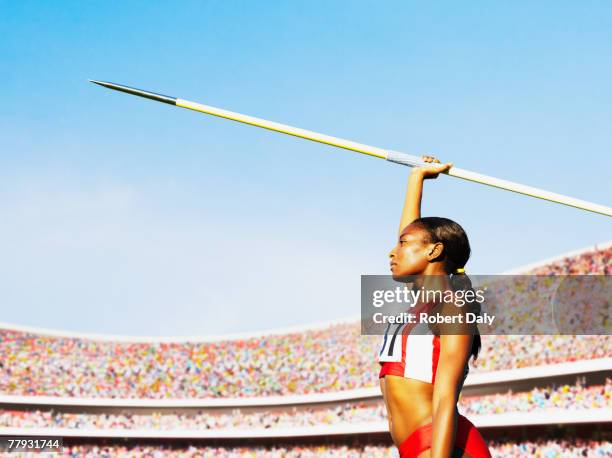 athlete with javelin in arena - lancer du javelot photos et images de collection