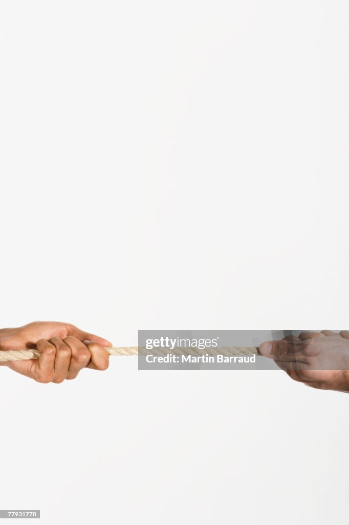 Two Hand Rope Pull Two Hands Pulling Opposite Ends Of A Rope High-Res Stock Photo - Getty ...