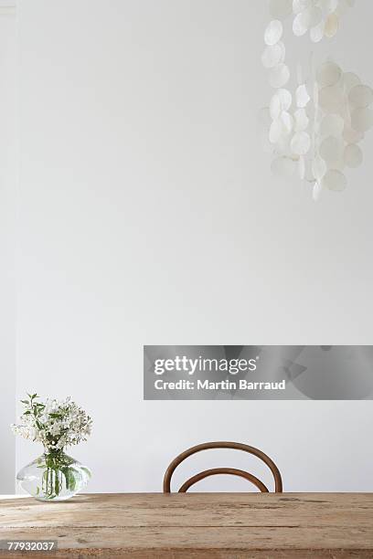 empty chair and vase on table - plain room stock pictures, royalty-free photos & images