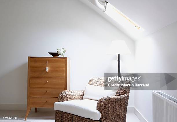 empty chair beside dresser - commode stockfoto's en -beelden