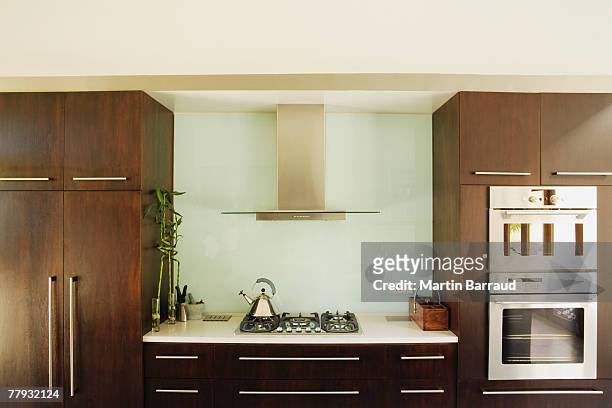 interior shot of a modern kitchen - kitchen front view stock pictures, royalty-free photos & images