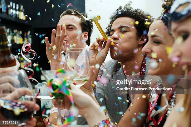 friends at a party with confetti - party konfetti stock-fotos und bilder