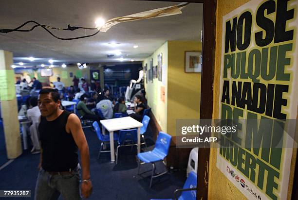 Man walks at "La Hija de Moctezuma" Bar, in Mexico City, 17 October, 2007. Pulque is a pre-Hispanic alcoholic beverage made from the fermented juice...