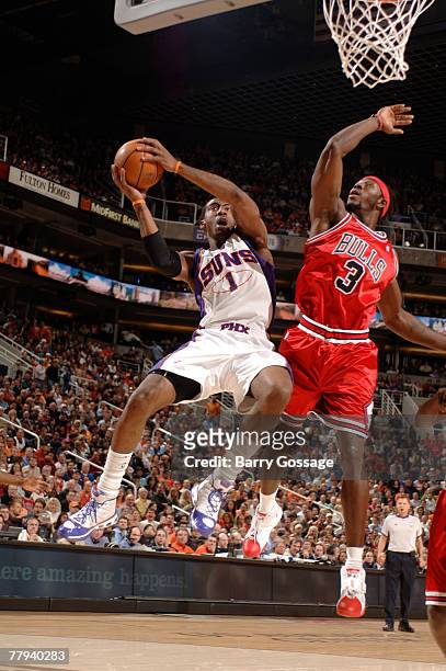 Amare Stoudemire of the Phoenix Suns drives for a shot around Ben Wallace of the Chicago Bulls in an NBA game played at U.S. Airways Center November...