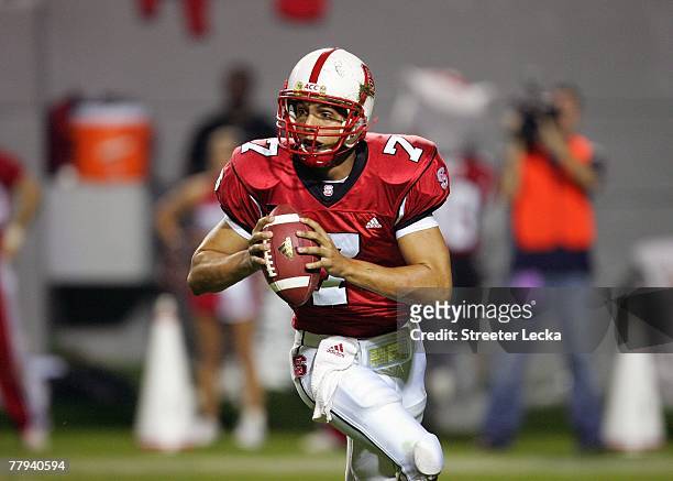 Daniel Evans of the North Carolina State Wolfpack looks to pass the ball during the game against the Virginia Cavaliers at Carter-Finley Stadium...