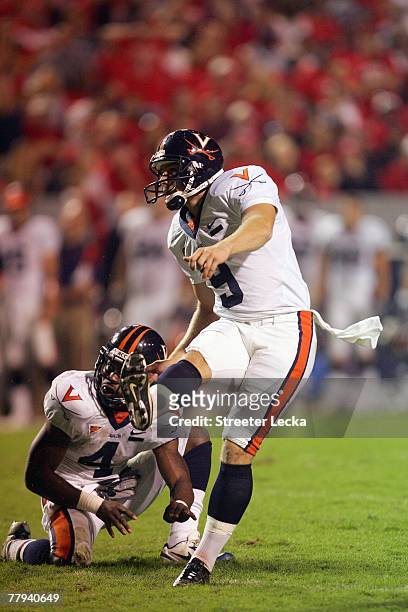 Chris Gould of the Virginia Cavaliers kicks a field goal during the game against the North Carolina State Wolfpack during their game at Carter-Finley...