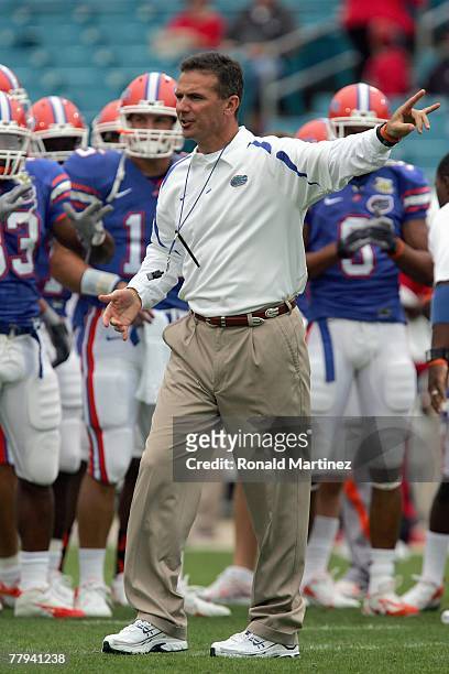Head coach Urban Myer of the Florida Gators yells instructions before the game against the Georgia Bulldogs at Jacksonville Municipal Stadium on...
