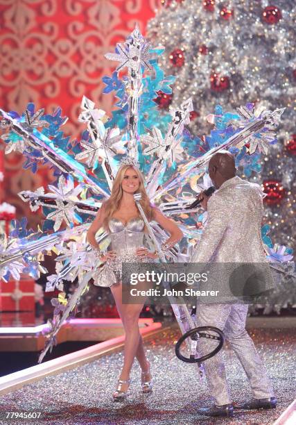 Model Heidi Klum and singer Seal onstage wearing Swarovski embellished garments by Victoria's Secret at the 12th Victoria's Secret Fashion show at...