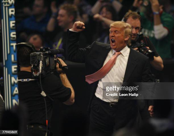 Donald Trump celebrates his victory over Vince McMahon at the main event of the night, "Hair vs. Hair", between Vince McMahon and Donald Trump....