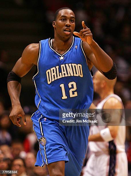 Dwight Howard of the Orlando Magic celebrates a basket against the New Jersey Nets during their game at the Izod Center on November 16, 2007 in East...