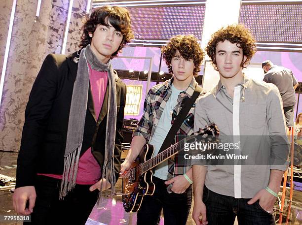 Musicians Joe Jonas, Nick Jonas and Kevin Jonas, Jonas Brothers, pose at rehearsals for the 2007 American Music Awards at the Nokia Theater on...