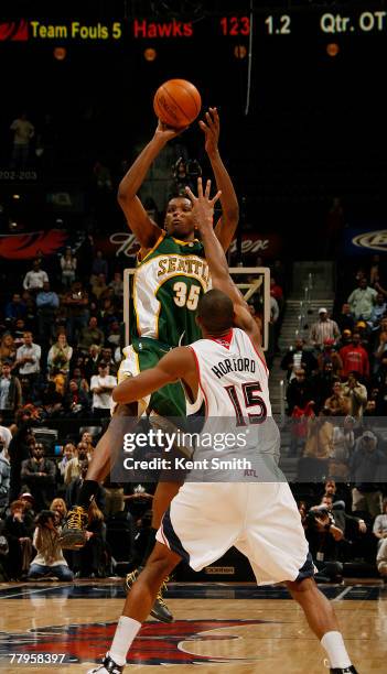 Kevin Durant of the Seattle SuperSonics hits the game-winning three point shot against Al Horford of the Atlanta Hawks on November 16, 2007 at the...