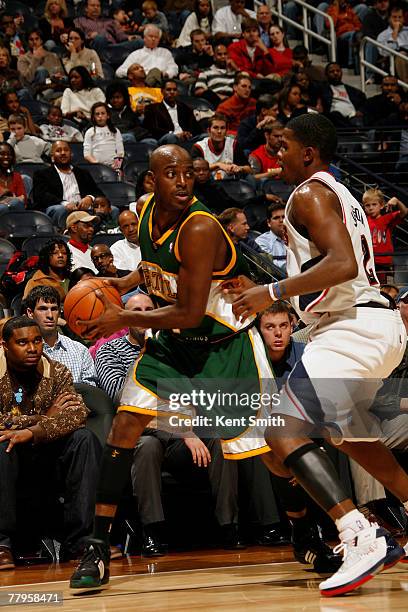 Damien Wilkens of the Seattle SuperSonics guards against Joe Johnson of the Atlanta Hawks on November 16, 2007 at the Philips Arena in Atlanta,...